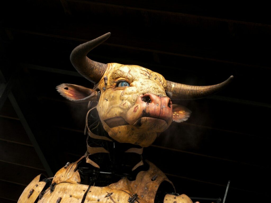 A detailed close-up of a bull's head with horns